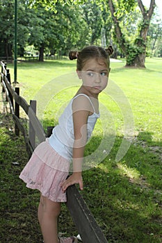 Beautiful little girl posing in a mini skirt