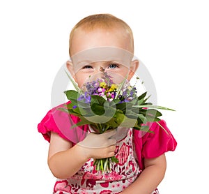 Beautiful little girl with a posy of flowers