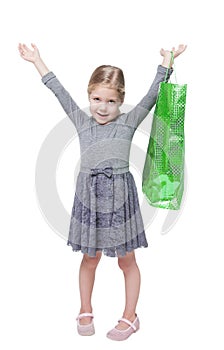 Beautiful little girl with shopping bag isolated