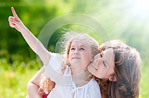 Beautiful little girl showing to her mother