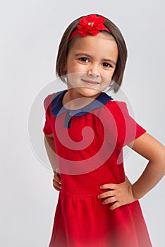 Beautiful little Girl smiling in red dress