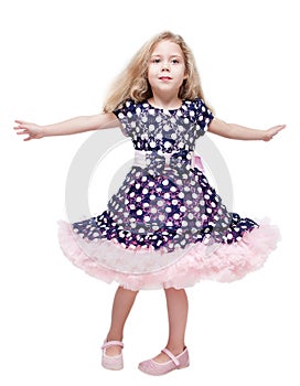 Beautiful little girl spinning around isolated