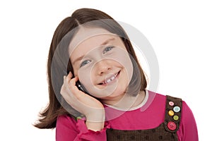 Beautiful little girl talking on a mobile phone