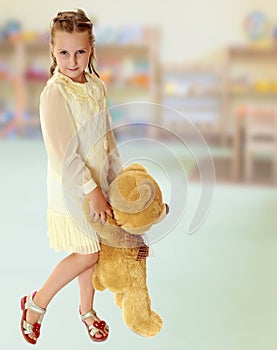 Beautiful little girl with a Teddy bear