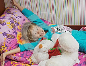 Beautiful little girl with a toy polar bear.