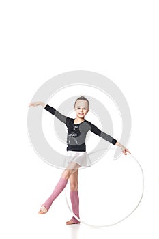 Beautiful little gymnast with the hoop