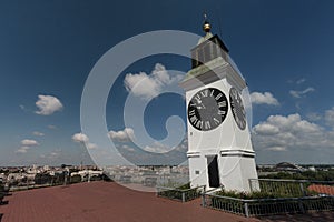 Beautiful little urban clock on the top of the hill in Novi Sad in Serbia. Urban touristic spot belvedere over the beautiful city