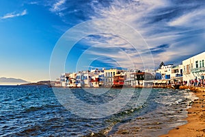 Beautiful Little Venice, Mykonos, Greece. Romantic neighborhood with whitewashed bars, cafes, restaurants. Sunset sky