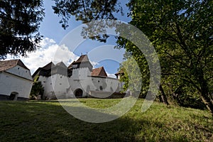 The beautiful little village of Viscri and the castle in the heart of rural Romania countryside in Transylvania on the top of the