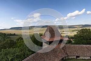 The beautiful little village of Viscri and the castle in the heart of rural Romania countryside in Transylvania on the top of the