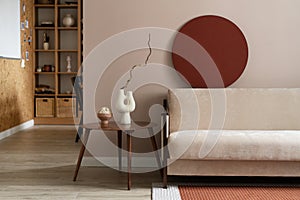 beautiful living room with beige sofa. View of modern scandinavian style interior. Home staging and minimalism concept.