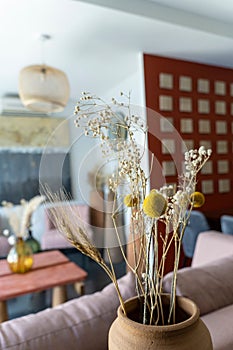 Beautiful living room interior in new luxury home with view of kitchen