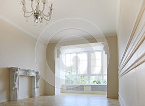 Beautiful living room in light tones with big window