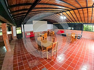 beautiful living room with lots of chairs and tables