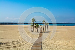Beautiful local sandy beach Playa de la Puntilla on Atlantic ocean in El Puerto de Santa-Maria, Andalusia, Spain photo