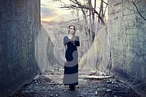 Beautiful lonely girl in long dress