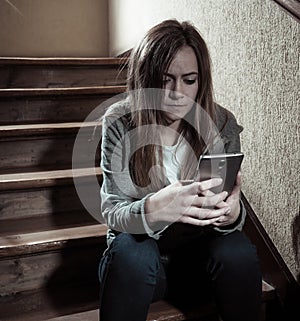 Beautiful lonely young girl depressed and worried suffering from bullying and harassment at school