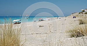 Beautiful long beach, waves with white foam and blue sea. Relax chill enjoy summer vacation concept