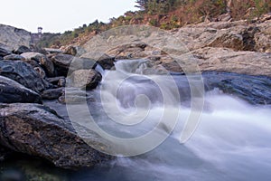 Beautiful long exposure stock image of water flowing down the hill