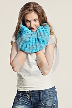 Beautiful girl in a blue scarf