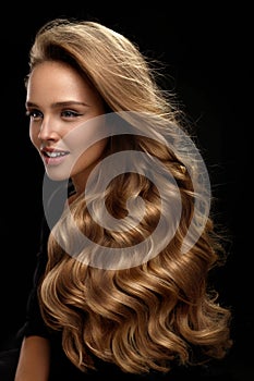 Beautiful Long Hair. Woman Model With Blonde Curly Hair