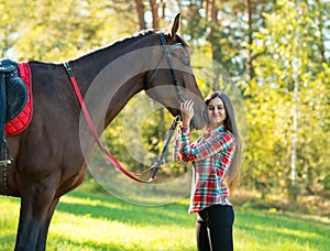 Beautiful long hair young woman with horse
