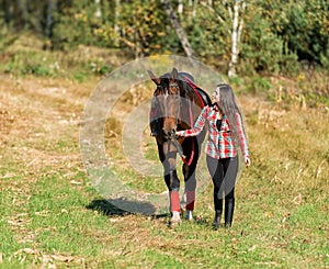 Beautiful long hair young woman with horse