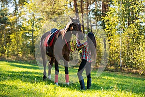 beautiful long hair young woman with horse outdoor