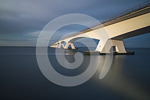 Beautiful long Zeeland bridge leading over the sea in Holland