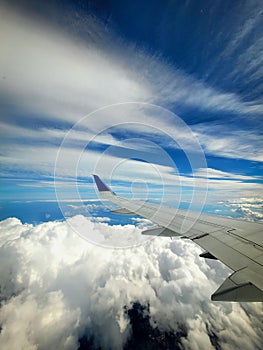 A Beautiful Look Out Of A Plane's Window Over An Incredible Cloudy Sky