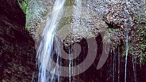 beautiful loopable waterfall background closeup with relaxing water flow sound of nature in 4k