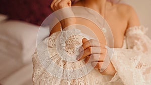 Beautiful lovely bride back in wedding luxury dress veil. Pretty well-groomed gorgeous woman