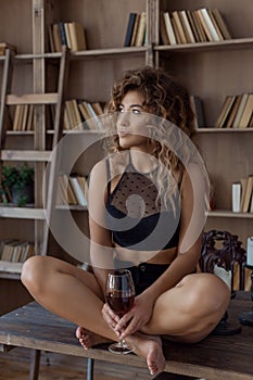 Beautiful lovely girl with spots Vitiligo in her arms with a glass of wine