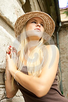 Beautiful lovely woman with straw hat posing