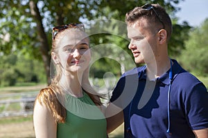 Beautiful loving couple flirting in the park on beautiful sunny day