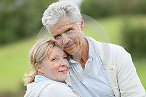 Beautiful loving senior couple outdoors