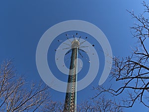 Beautiful low angle view of rotating drop tower in popular amusement park Wurstelprater in Vienna, Austria.