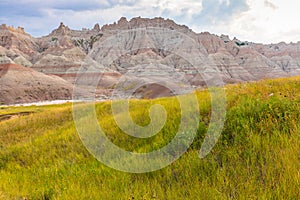 Beautiful, lush grasslands and eroded hills in Badlands National Park, South Dakota.