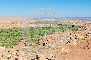 Beautiful lush green oasis with buildings and mountains at Todra Gorge, Morocco, North Africa