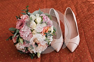 Beautiful lush wedding bouquet of white and pink peony and roses.