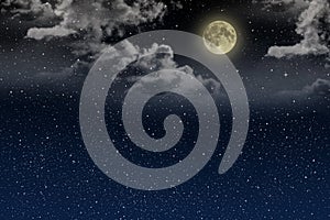 Beautiful magic blue night sky with clouds and fullmoon and stars