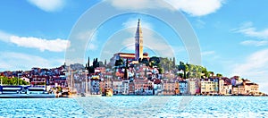 Beautiful  magical city landscape with sea, colorful houses and an ancient tower in Rovinj, Croatia. popular tourist attraction.