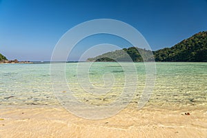 Beautiful Mai Ngam beach and shallow water coral reef in Surin island national park, Pang Nga, Thailand