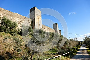 Beautiful majestic monteriggioni castle towers against bright blue winter sky, Tuscany, Italy