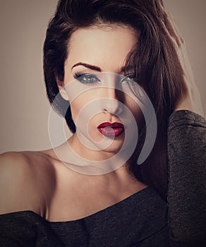 Beautiful makeup woman with red lipstick and long lashes lo