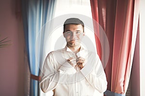 Beautiful man, groom posing and preparing for wedding