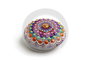 Beautiful mandala hand painted on a sea stone, isolated