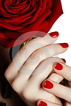 Beautiful manicured woman's hands with red nail polish. Beautifu