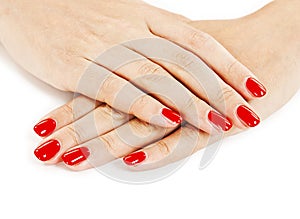 Beautiful manicured woman's hands with red nail polish photo