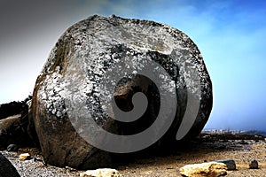 Beautiful massive granite boulder at the shore